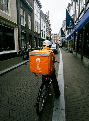 Delivery bike with orange bag